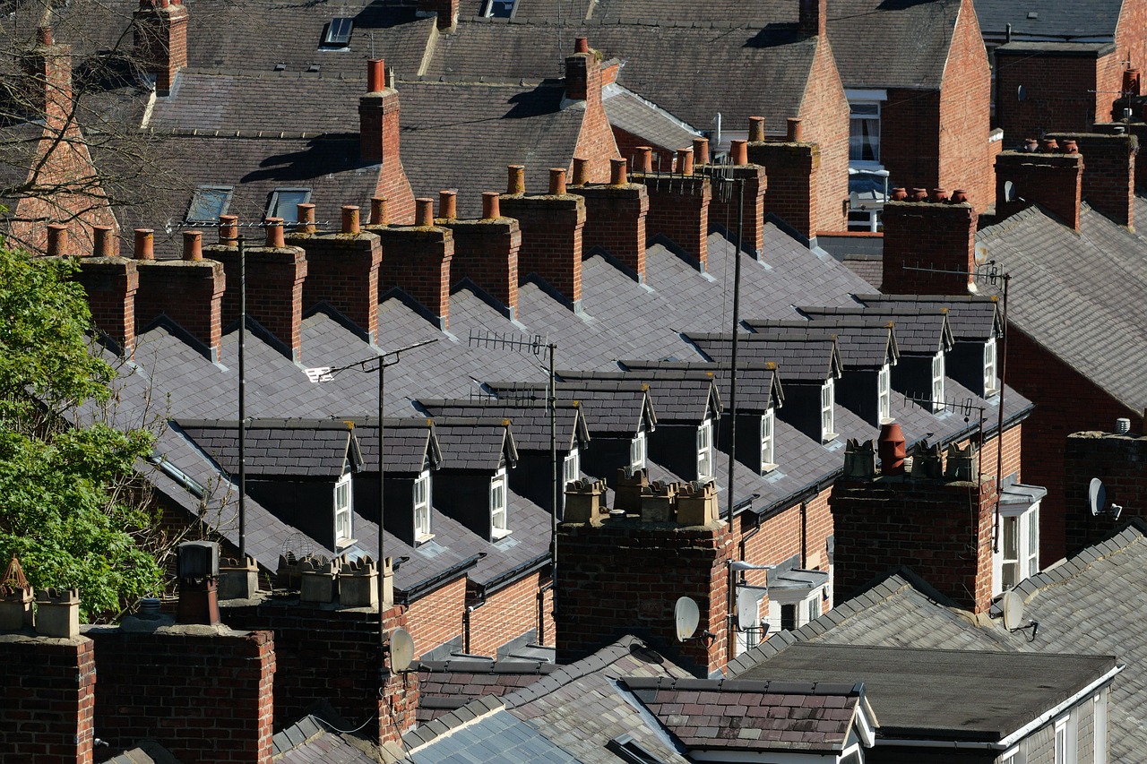 Rows of Victorian terraced houses with slate roofs and brick chimneys